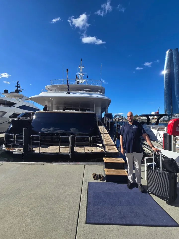 Ahmed Elsayed with his mobile treatment kit at a Sydney Harbour marina, arriving for an after-hours session