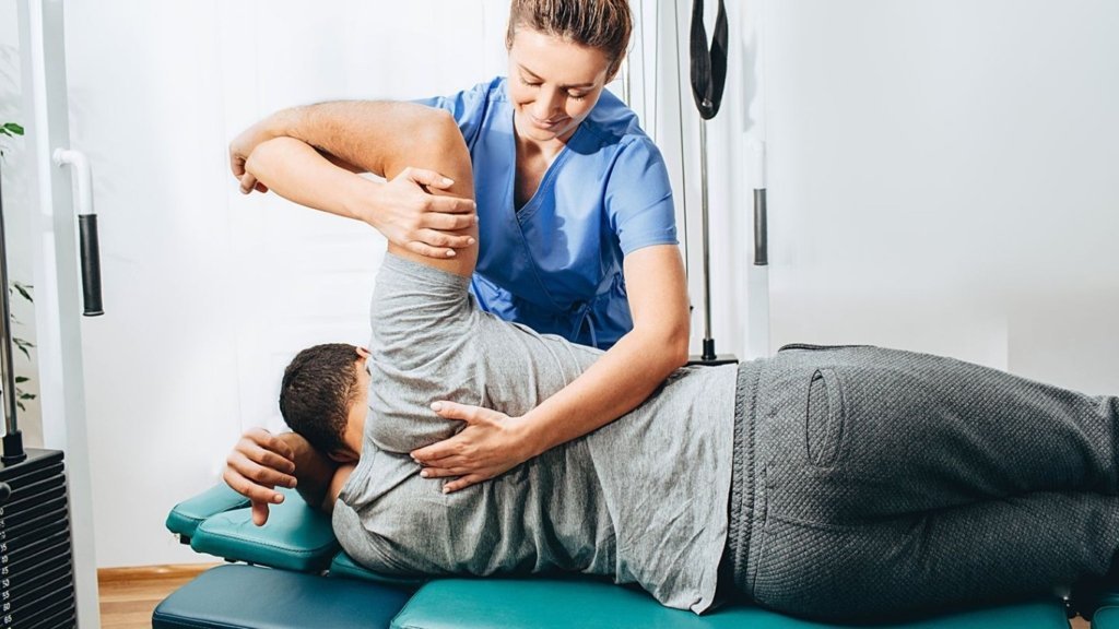 Physiotherapist performing manual therapy for back and neck pain relief
